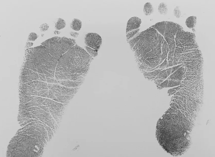 A black and white photo of two footprints